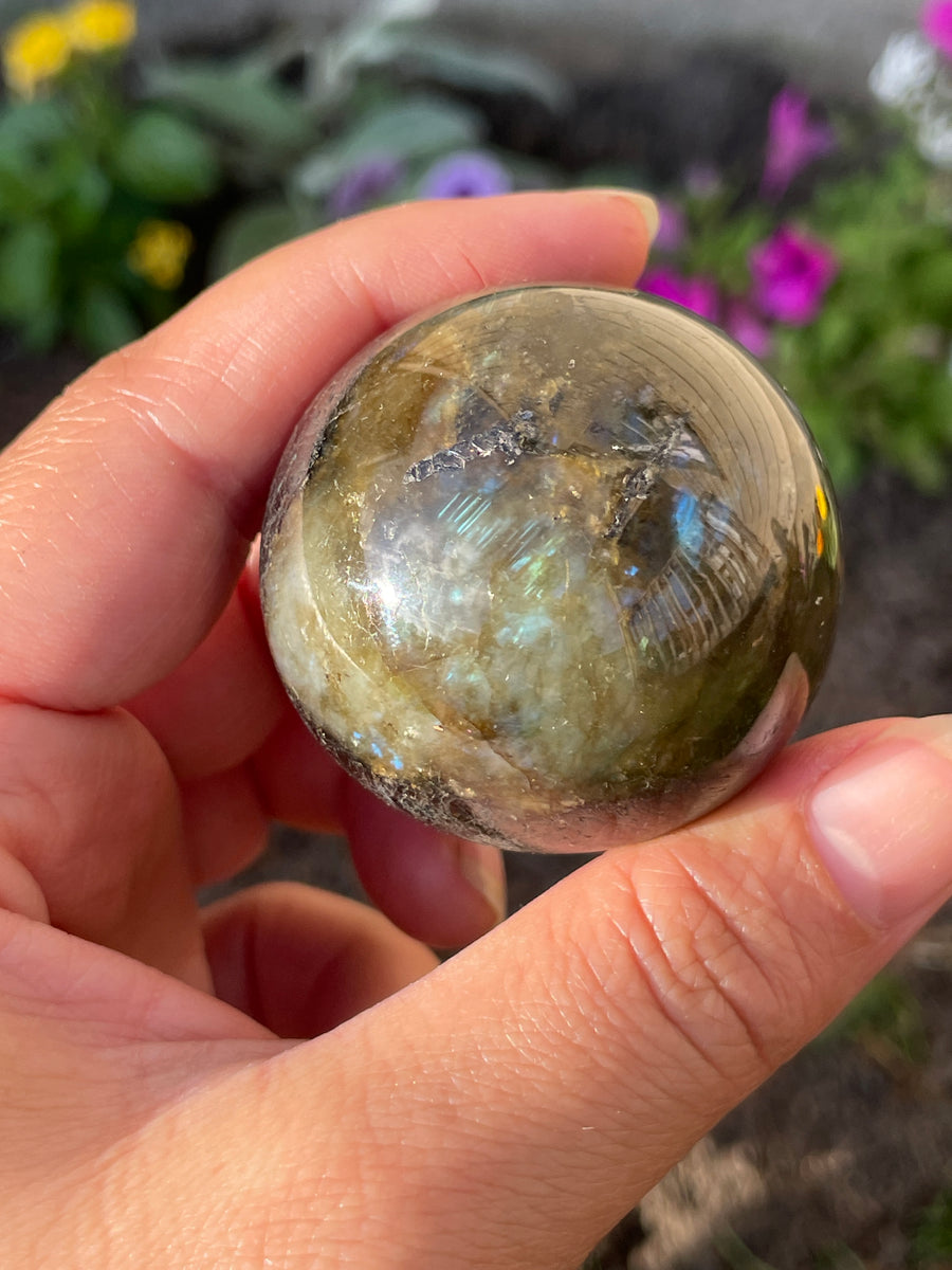 Labradorite sphere with flash