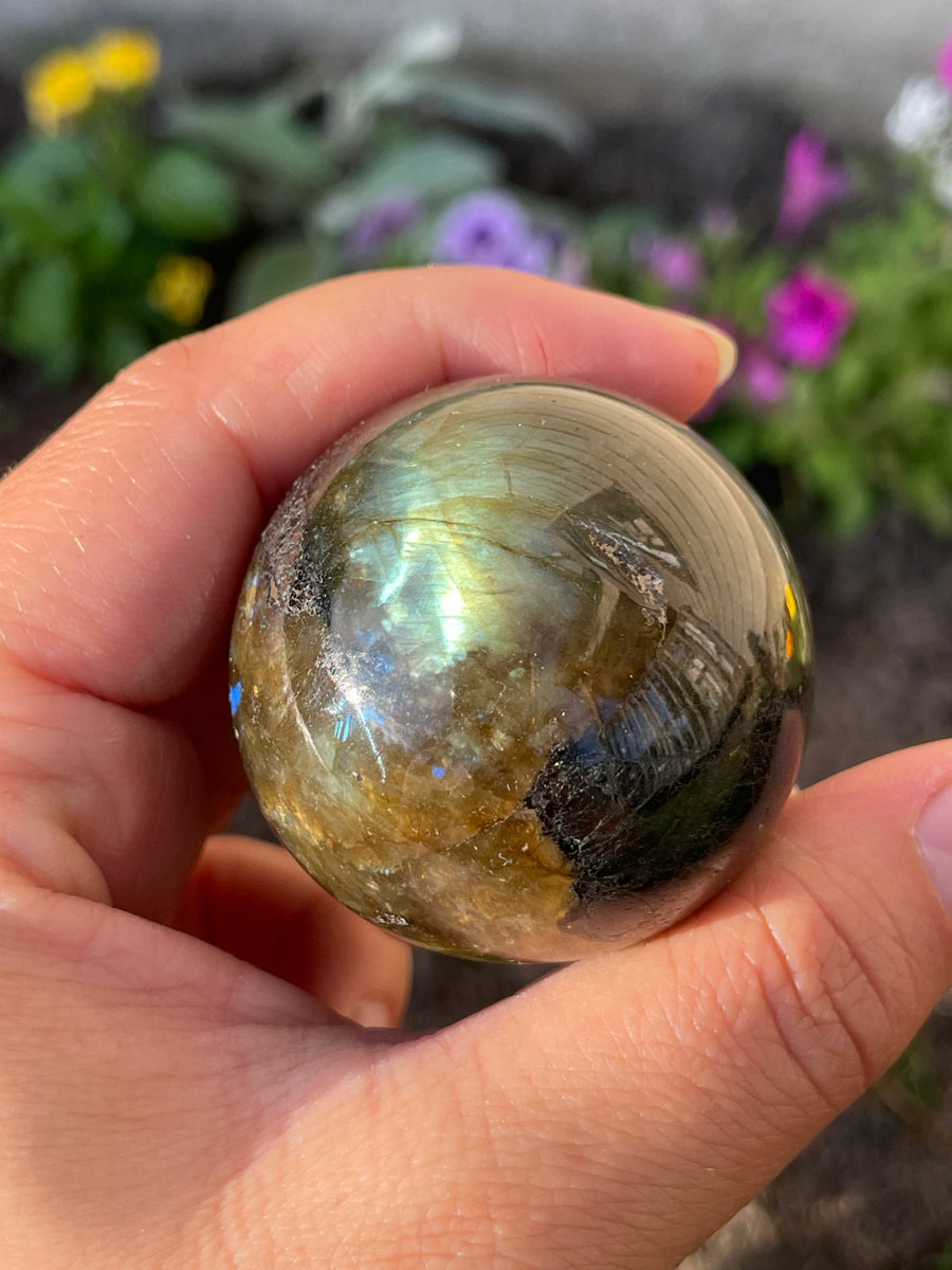 Labradorite sphere with flash