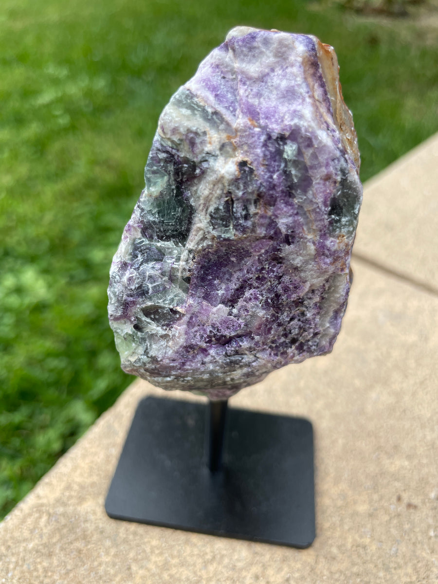 Raw Fluorite specimen on stand