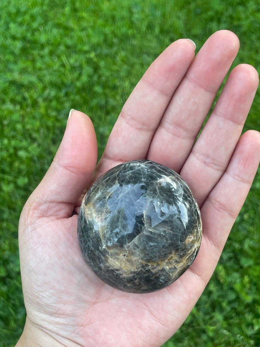 Black moonstone palm stone