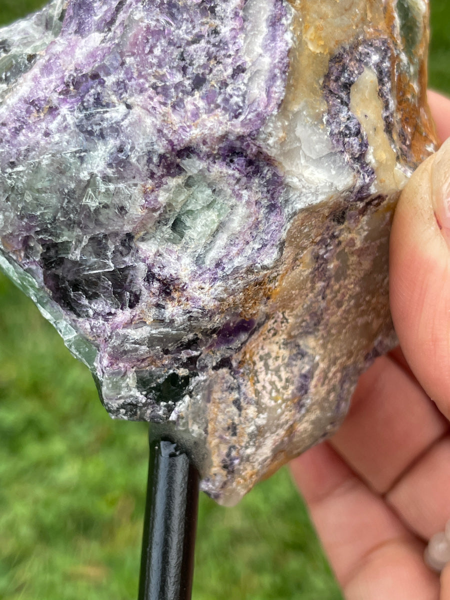 Raw Fluorite specimen on stand