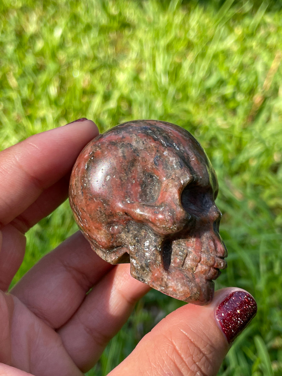 Red jasper black tourmaline and Quartz skull carving