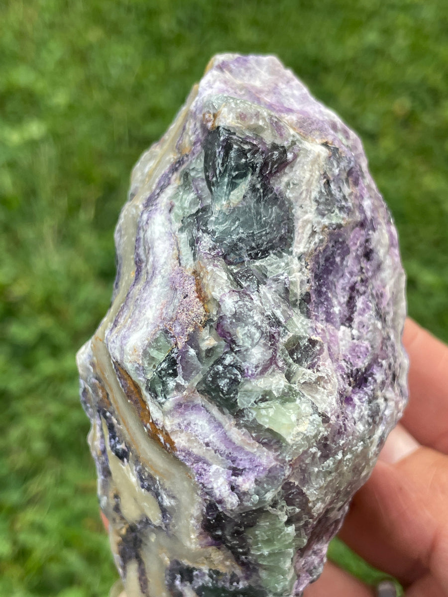 Raw Fluorite specimen on stand