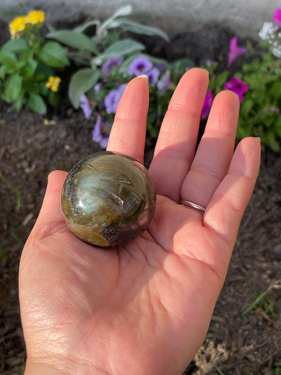Labradorite sphere with flash