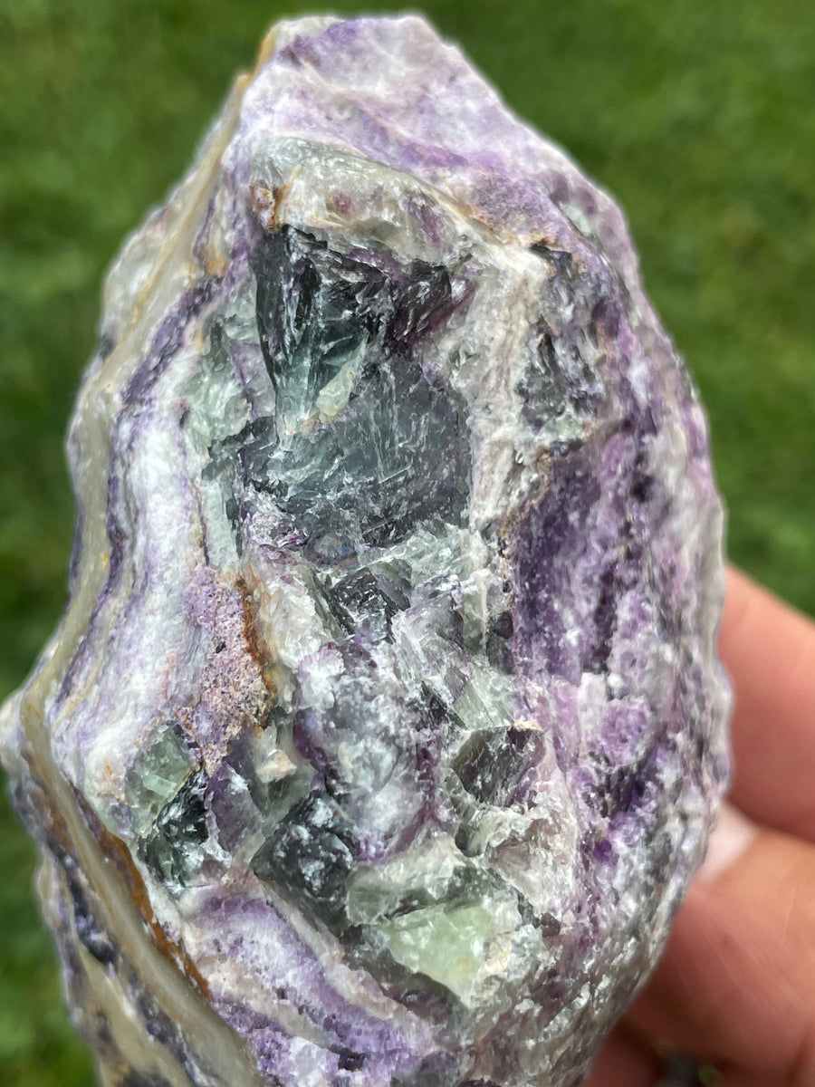 Raw Fluorite specimen on stand