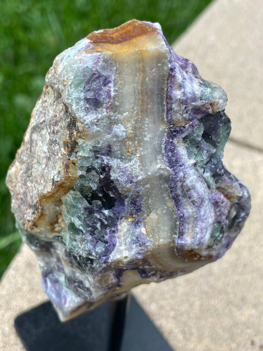 Raw Fluorite specimen on stand