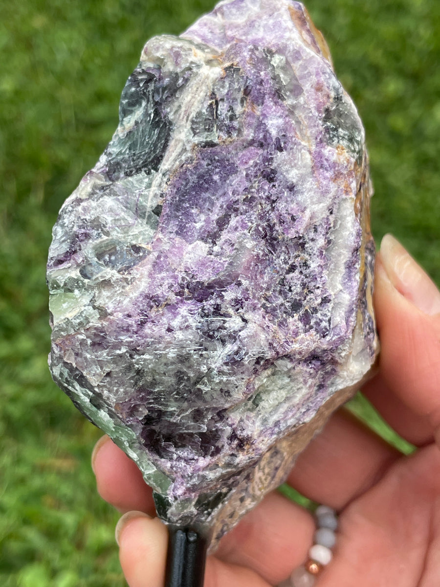 Raw Fluorite specimen on stand