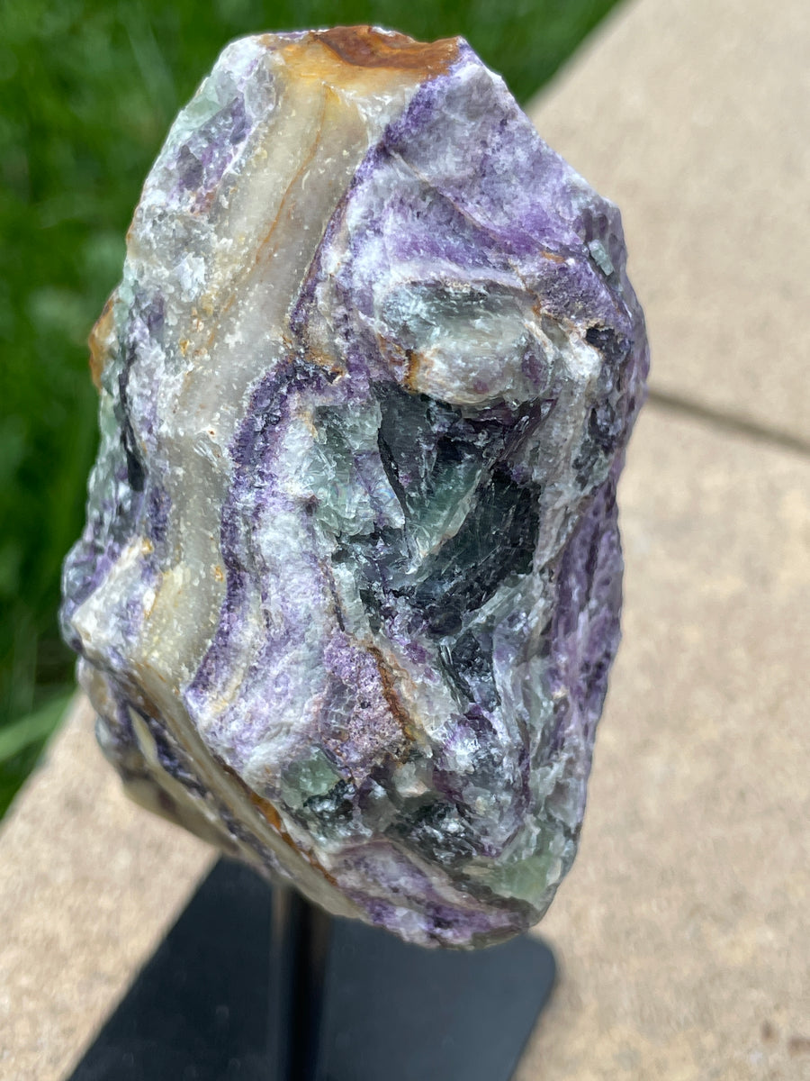 Raw Fluorite specimen on stand