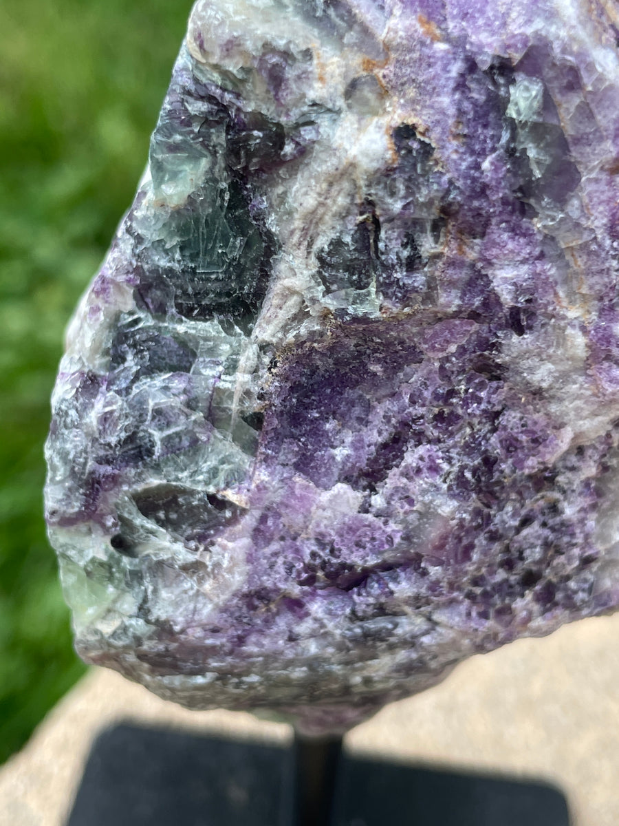 Raw Fluorite specimen on stand