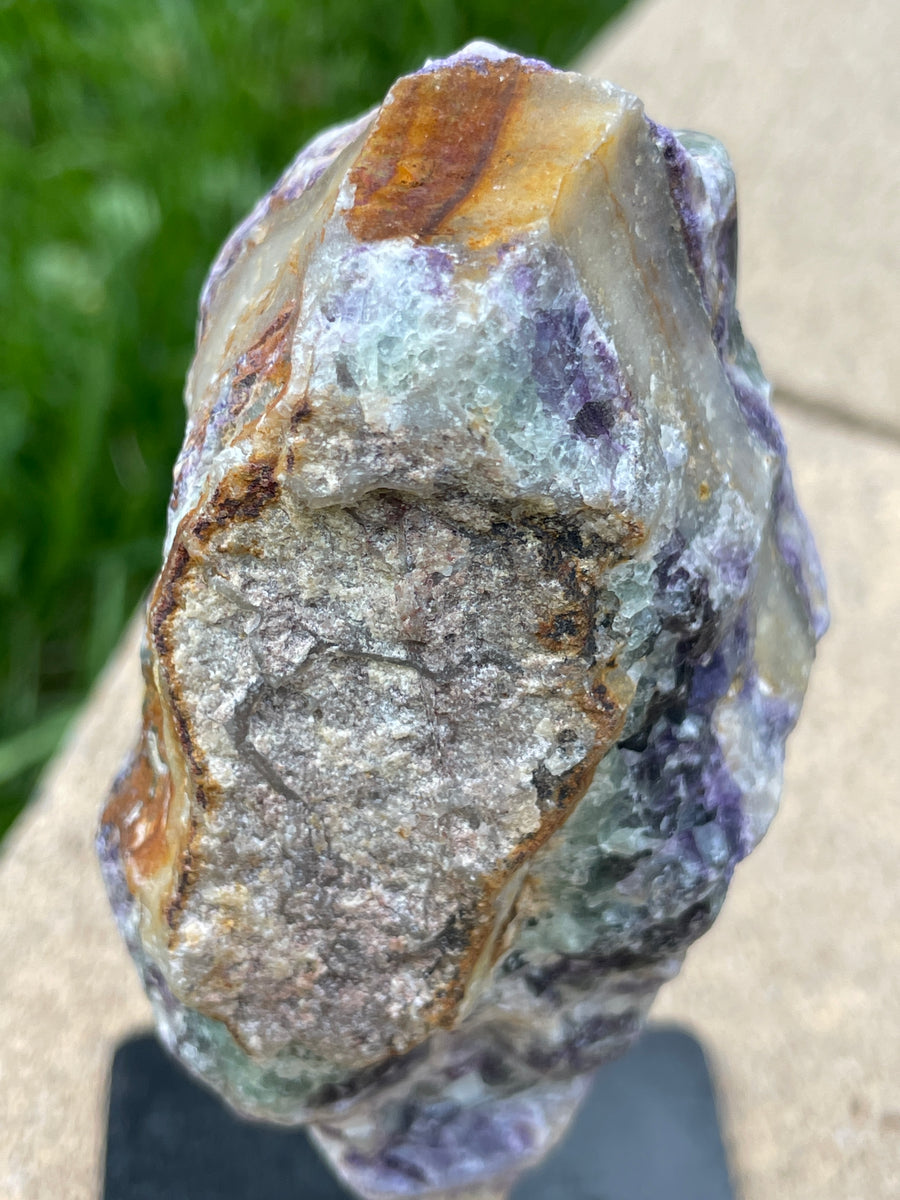 Raw Fluorite specimen on stand