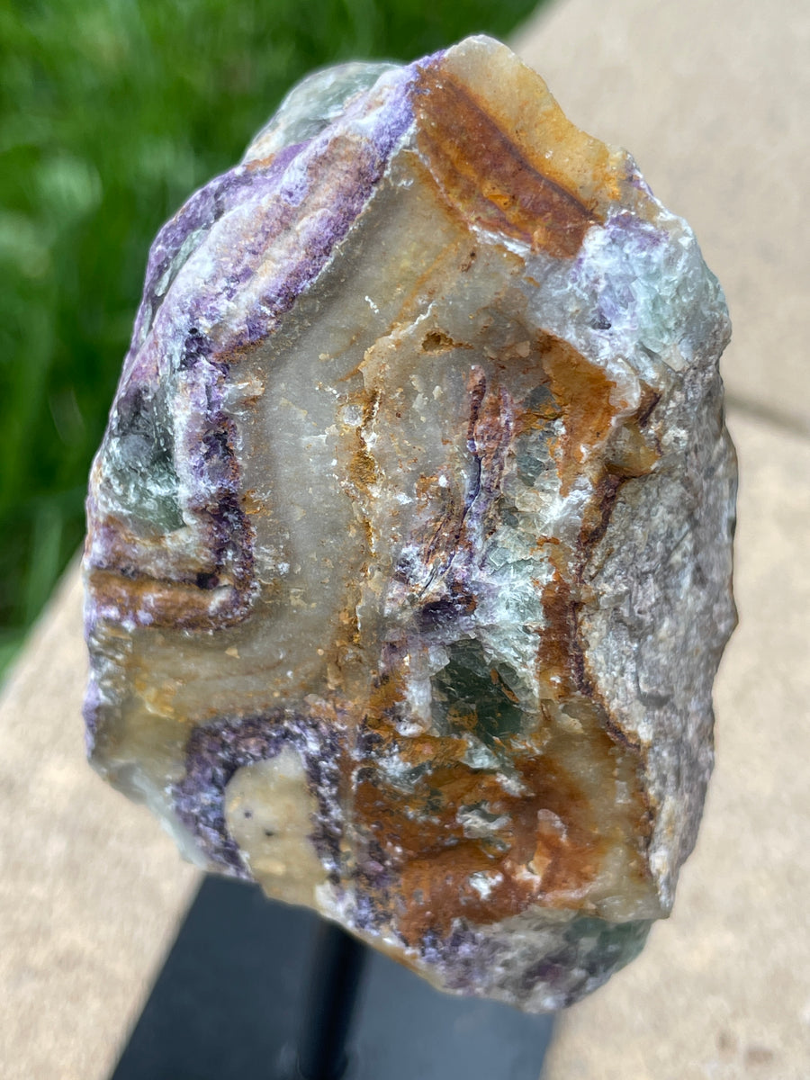 Raw Fluorite specimen on stand